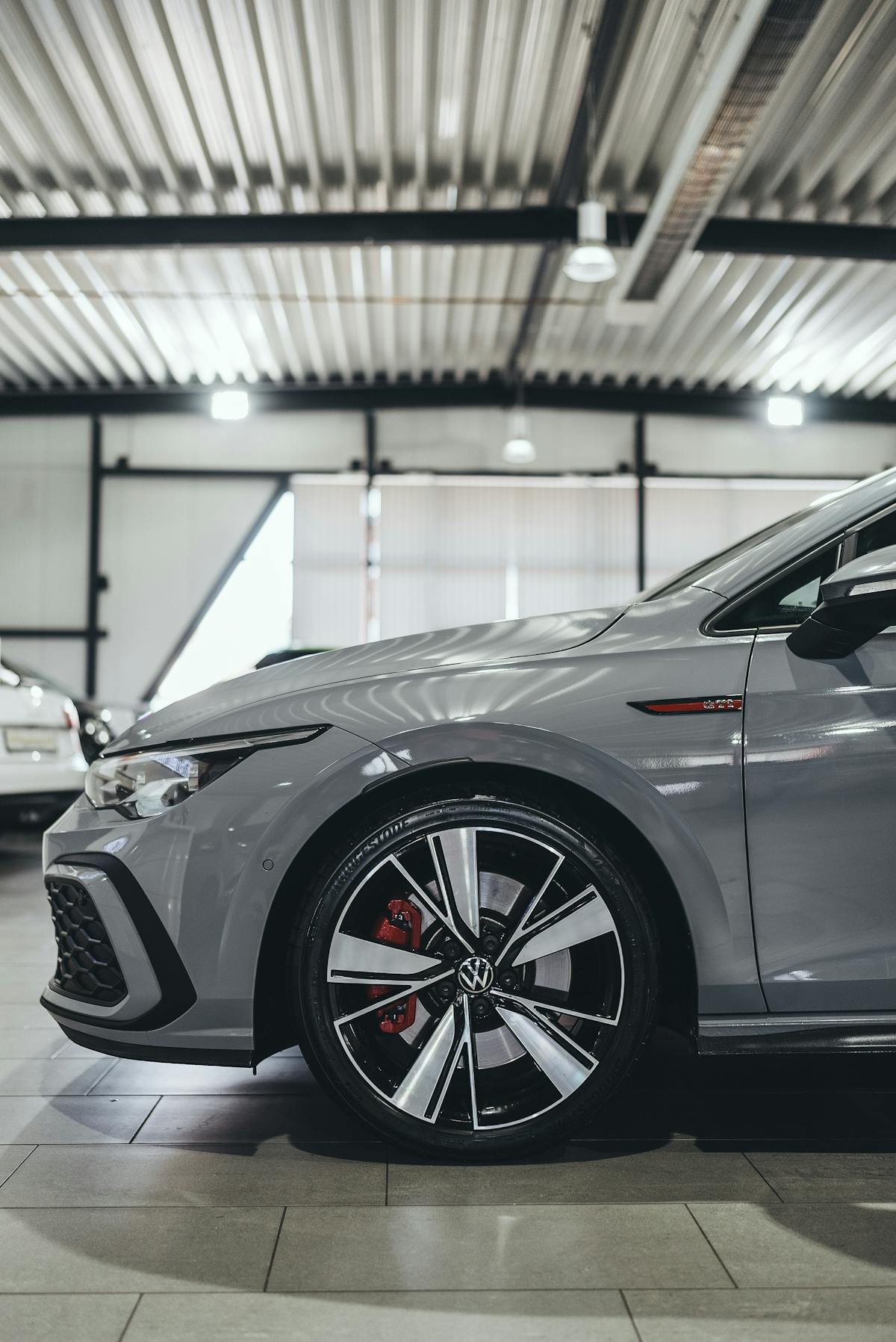 Close-up of a polished car wheel in a showroom